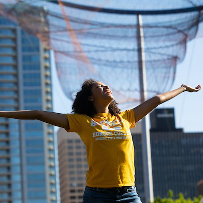 Student standing in the sun